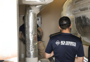 KCA services technician performing air duct cleaning